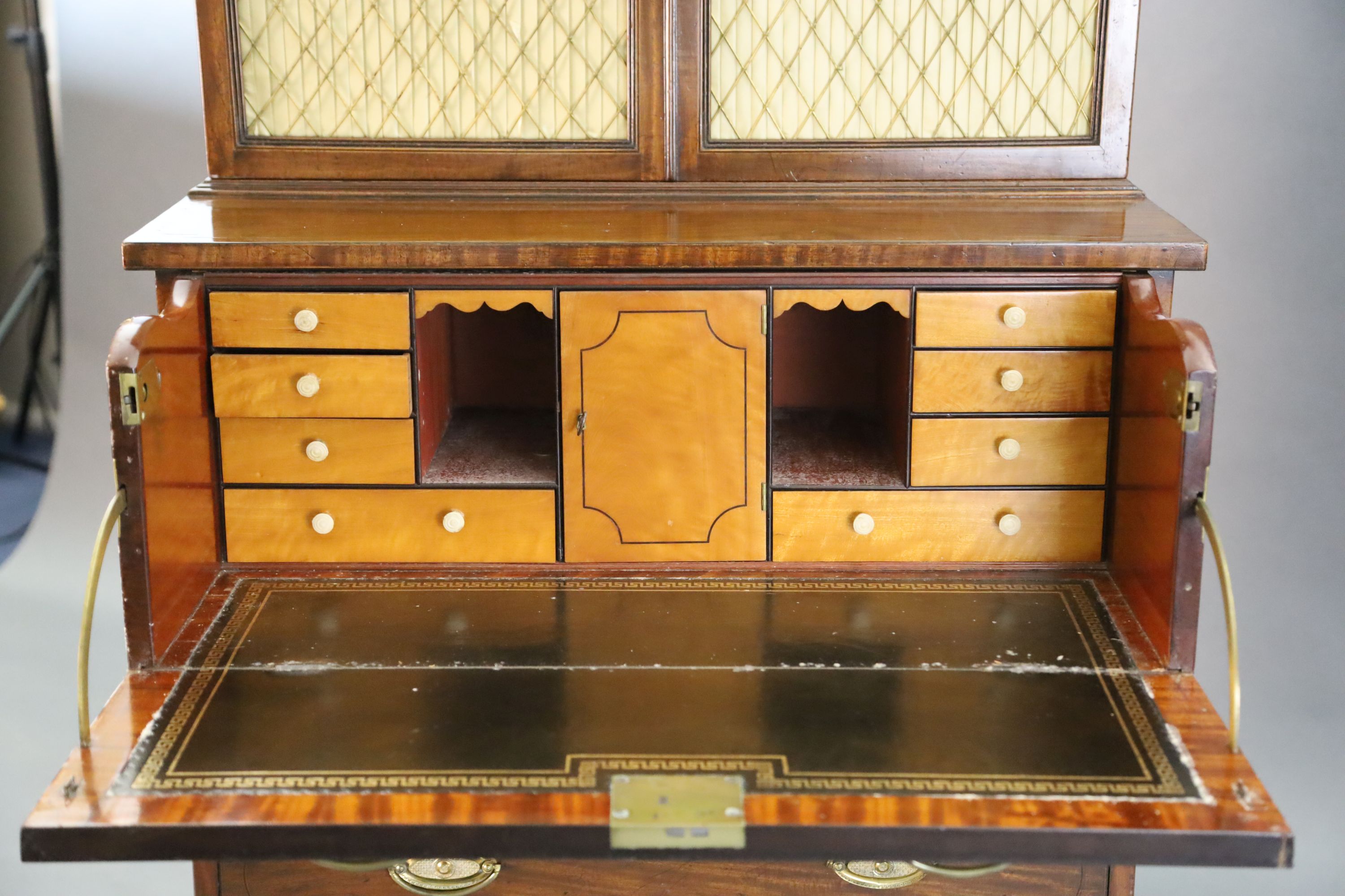 A Regency mahogany secretaire bookcase, W.2ft 9in. D.1ft 8in. H.6ft 1in.